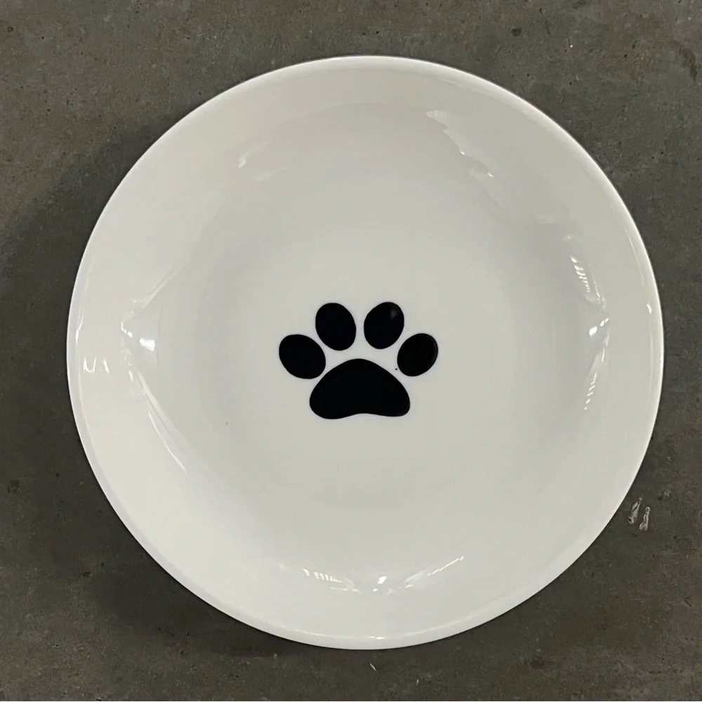 White Ceramic Dog / Cat Bowl with Black Paw. 6” Diameter x 1” High.